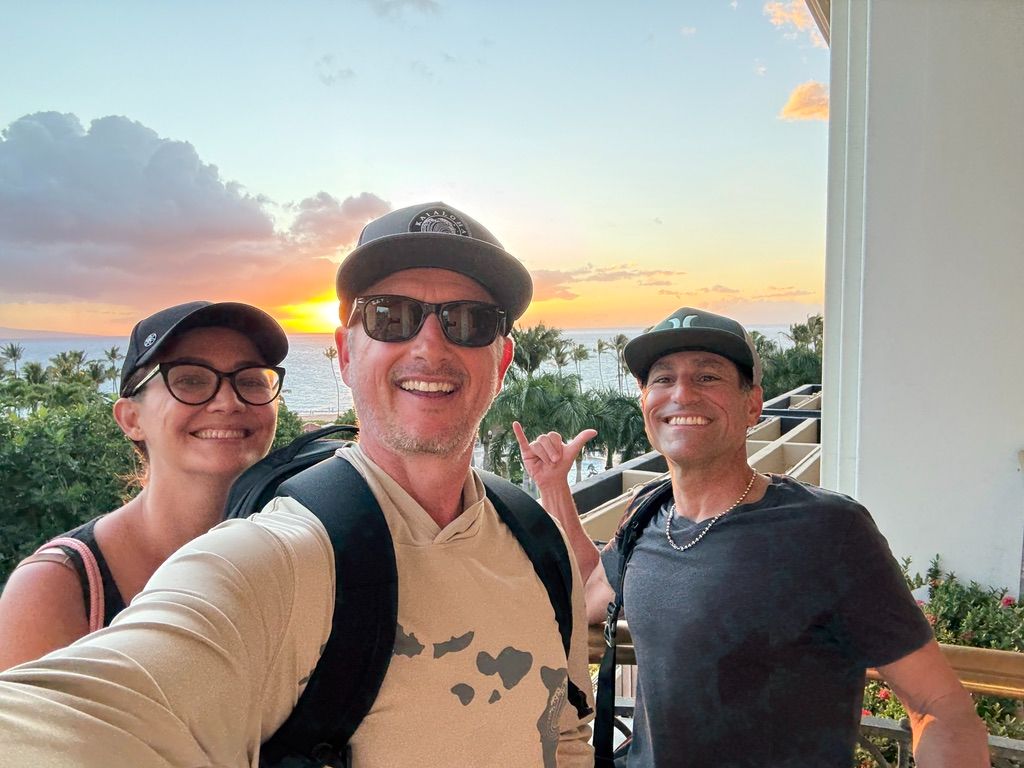 Kris Bradley with friends at a Maui resort at sunset.